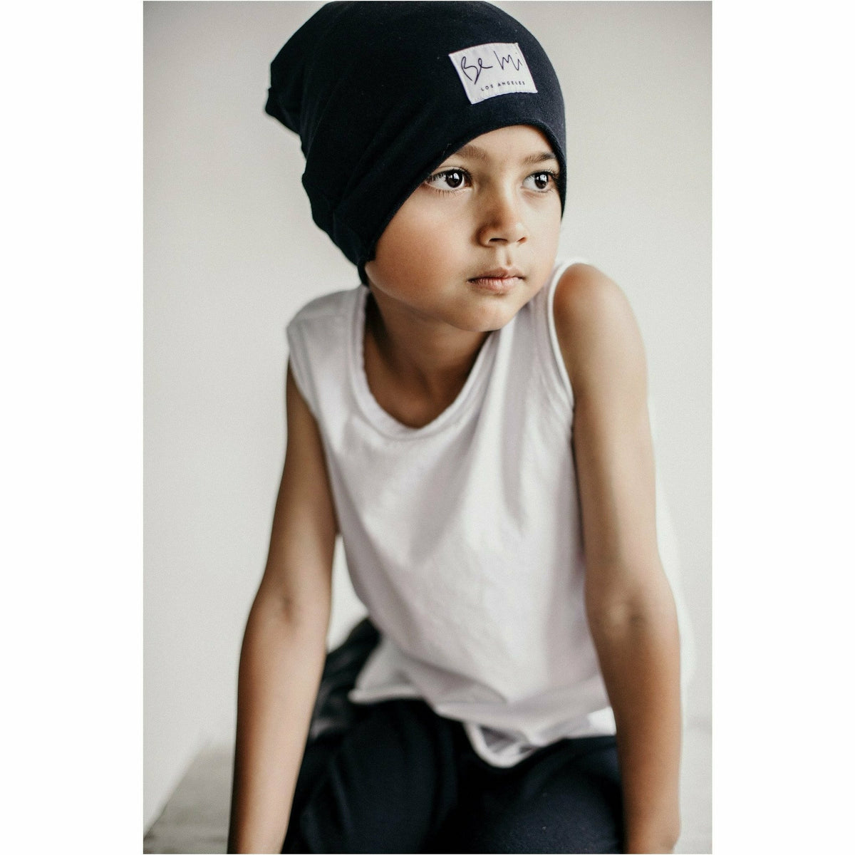 Organic oversized beige beanie from Be Mi Los Angeles, soft knit fabric, worn slouchy style for a cozy, casual look.