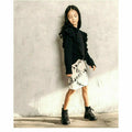 Black organic Victoria ruffle sleeve top by Be Mi Los Angeles, showcasing its stylish ruffled sleeves and soft fabric.