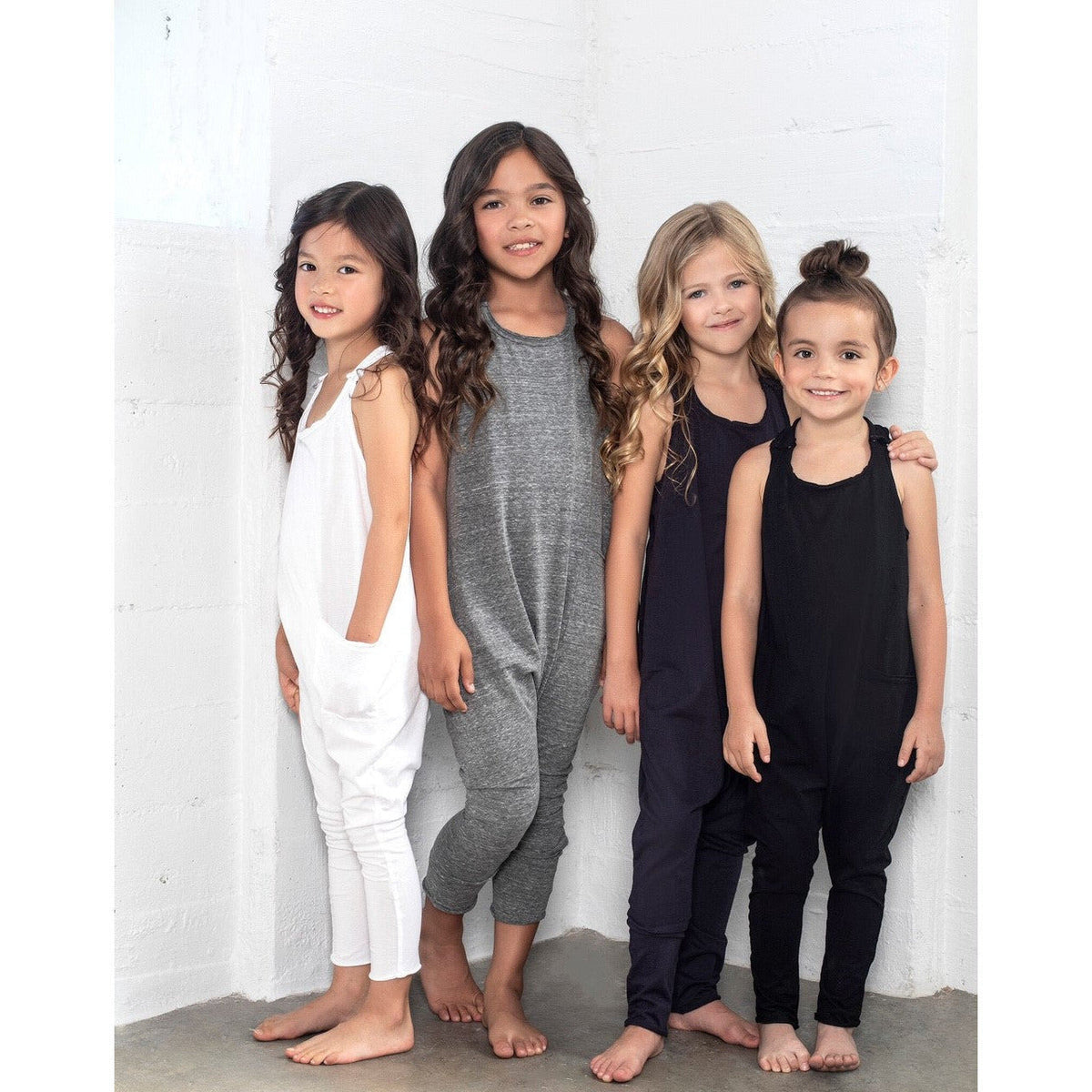 Pink Be Mi Los Angeles romper, lightweight and stylish, displayed on a hanger with a soft fabric texture.