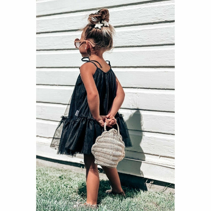 Black Mila Dress by Be Mi Los Angeles, stylish and elegant dress with a fitted silhouette, showcased on a model.