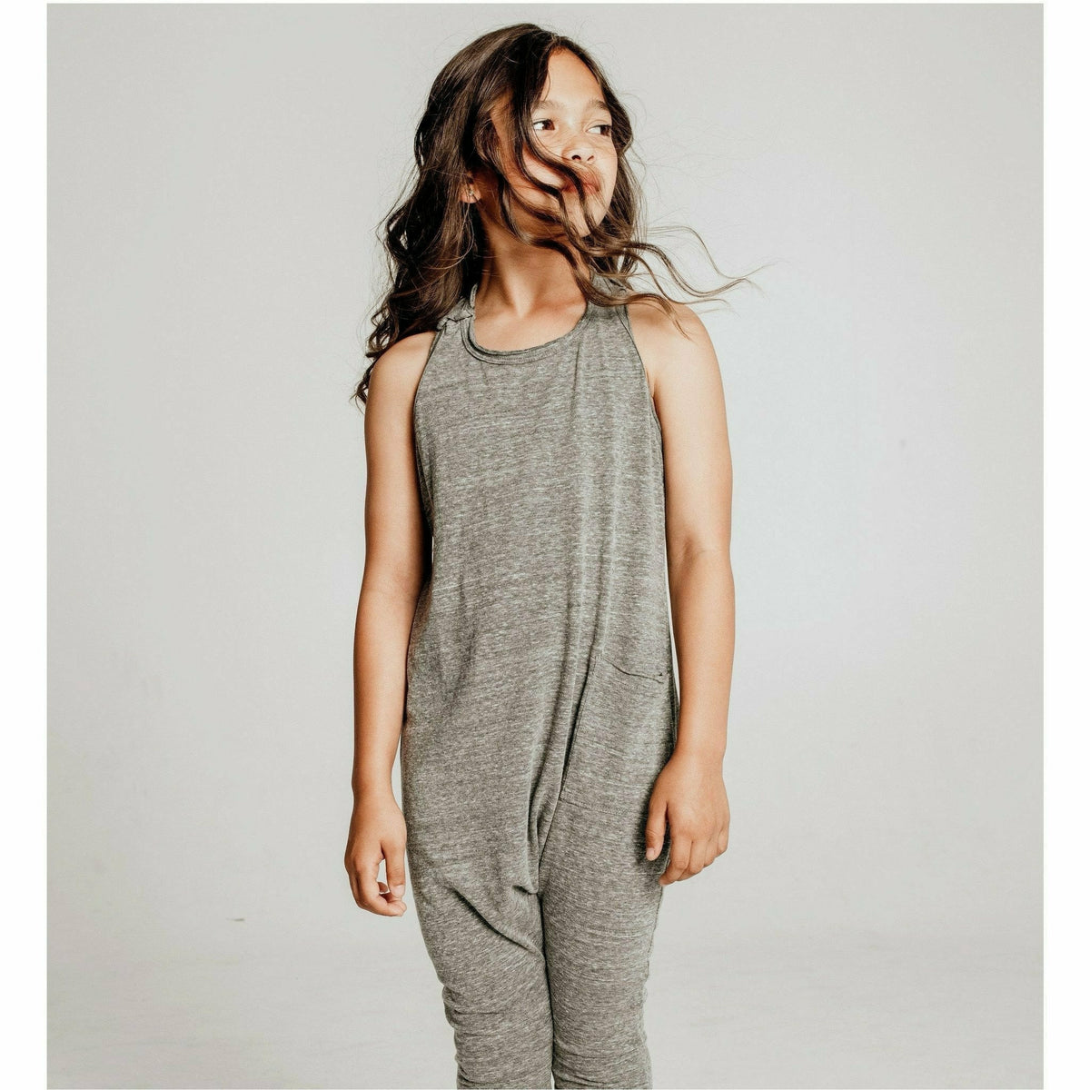 Heather grey romper by Be Mi Los Angeles, featuring a casual fit and sleeveless design, displayed on a mannequin.