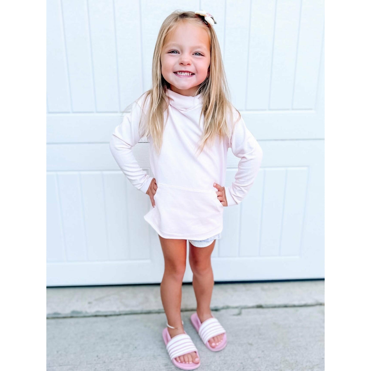 Pink organic Benji hoodie sweatshirt by Be Mi Los Angeles, showing its soft fabric and casual fit.