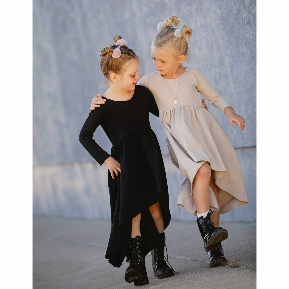 Black long sleeve Organic Giselle Dress by Be Mi Los Angeles, showing flowing fabric and elegant design.