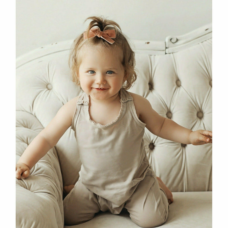 baby girl wearing tan cotton soft romper jumper