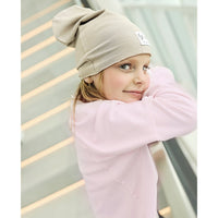 Organic oversized beige beanie by Be Mi Los Angeles, soft knit fabric, snug fit, suitable for winter and casual wear.