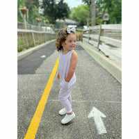 Pink Be Mi Los Angeles romper displayed on a hanger with a soft fabric texture and casual style.