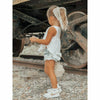 little girl wearing white cotton soft ruffle tank
