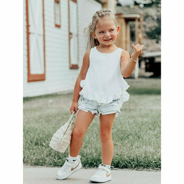 little girl wearing white cotton soft ruffle tank