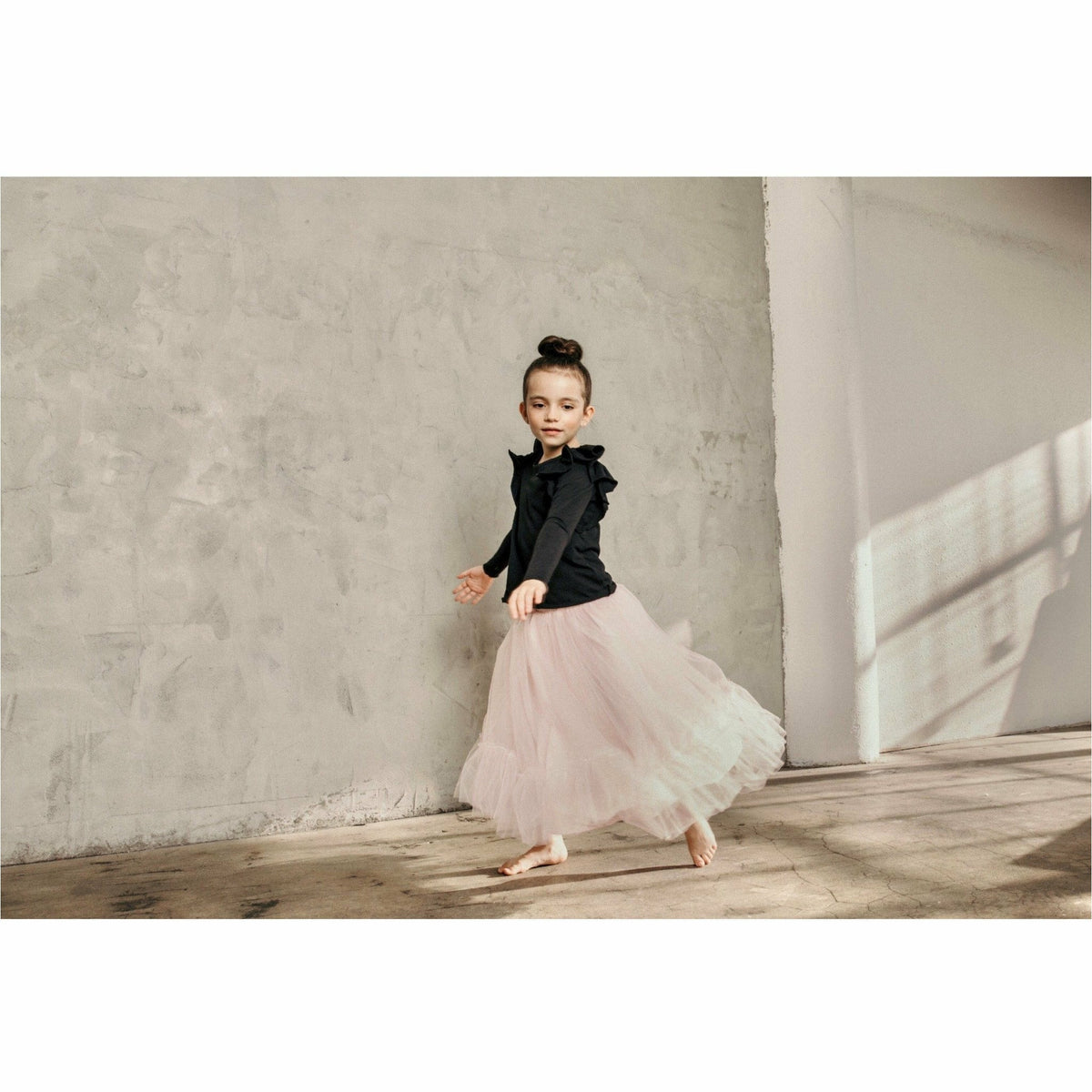 Pink ballerina skirt by Be Mi Los Angeles, flowing fabric with a soft waistband, perfect for dance or casual wear.