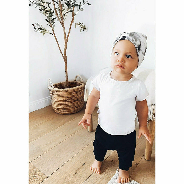 White Asher Baby Tee by Be Mi Los Angeles featuring a simple, stylish cotton design with short sleeves and a relaxed fit.