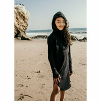 Be Mi Los Angeles Organic Luna Hoodie Dress hanging on a wooden hanger, showcasing its soft, eco-friendly fabric and relaxed fit.