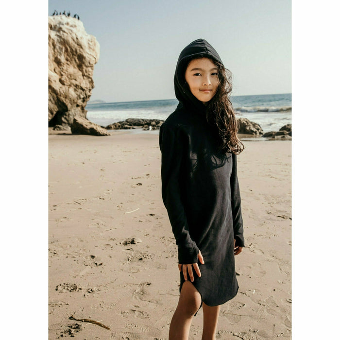 Be Mi Los Angeles Organic Luna Hoodie Dress hanging on a wooden hanger, showcasing its soft, eco-friendly fabric and relaxed fit.