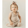 baby girl wearing cotton romper jumper soft in color tan