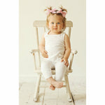 baby girl wearing white soft cotton romper jumper playsuit