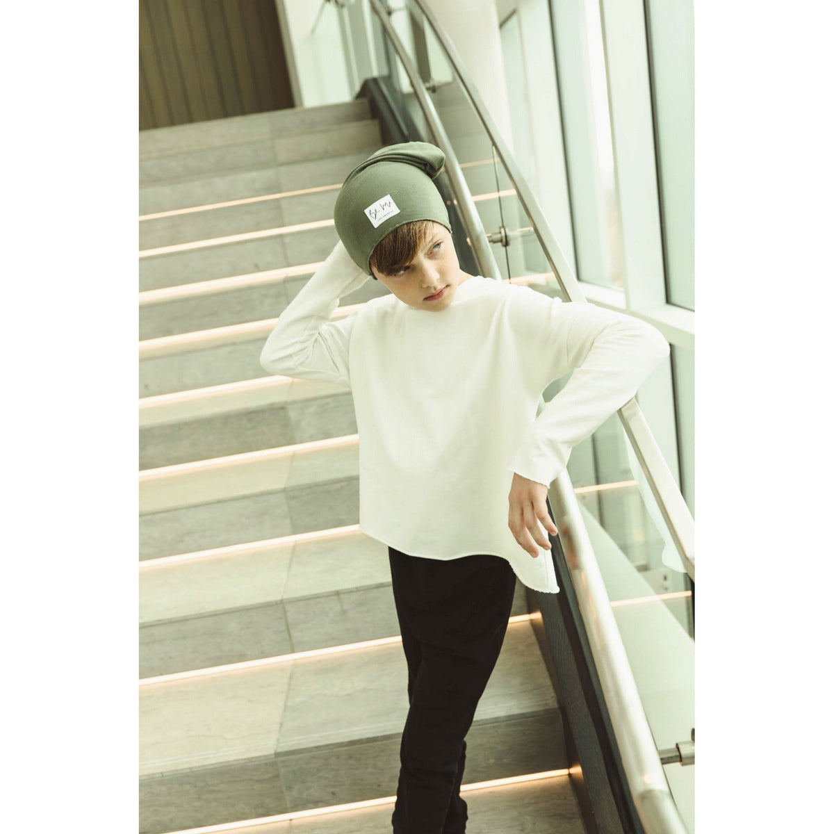 Be Mi Los Angeles Organic V Raw Edge Top sweatshirt, showcasing a casual black sweatshirt with raw edge details and a relaxed fit.