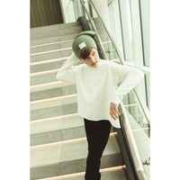 Be Mi Los Angeles Organic V Raw Edge Top sweatshirt, showcasing a casual black sweatshirt with raw edge details and a relaxed fit.