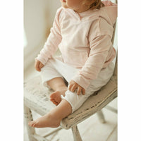 Pink organic baby hoodie from Be Mi Los Angeles featuring a soft, cozy design perfect for little ones.