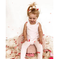 Pink Be Mi Los Angeles romper with short sleeves and relaxed fit, displayed on a hanger against a neutral background.