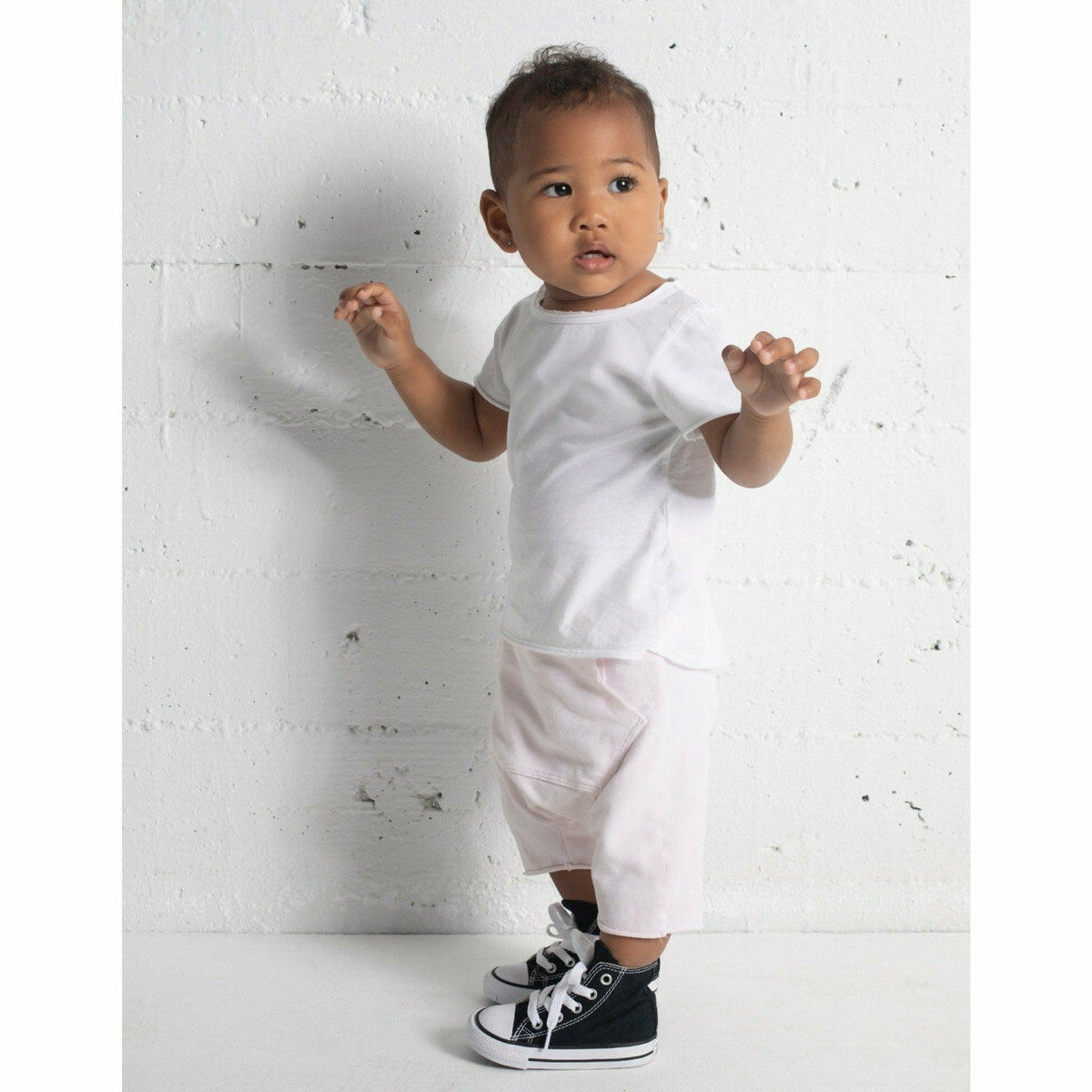 Black Asher Baby Tee by Be Mi Los Angeles, soft cotton T-shirt for infants with a comfortable fit and simple design.