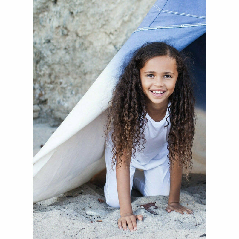 girl wearing white cotton romper jumper soft cotton white