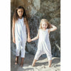 girl wearing white cotton romper jumper soft cotton white