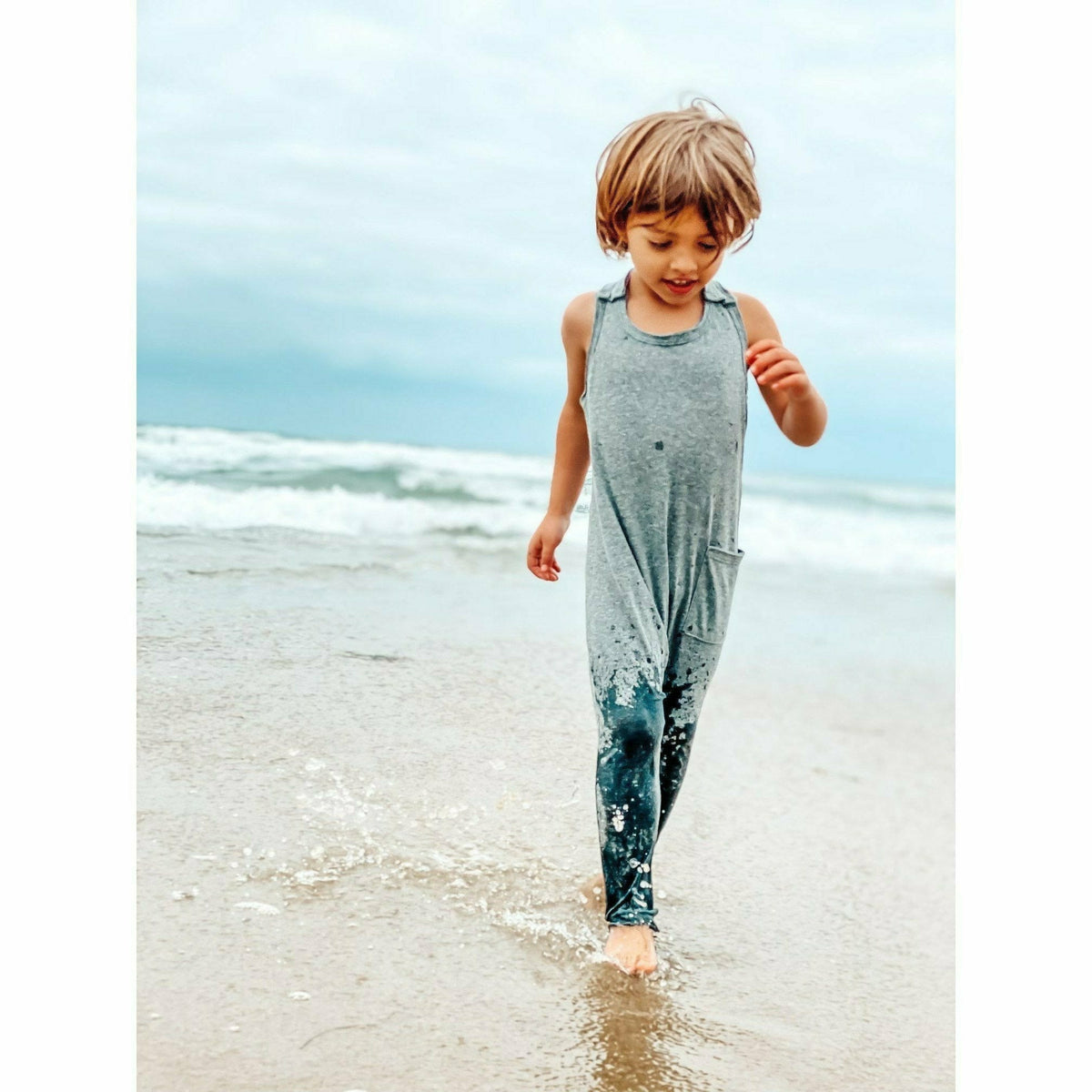 Heather grey romper by Be Mi Los Angeles featuring a casual, stylish design with short sleeves and a relaxed fit.