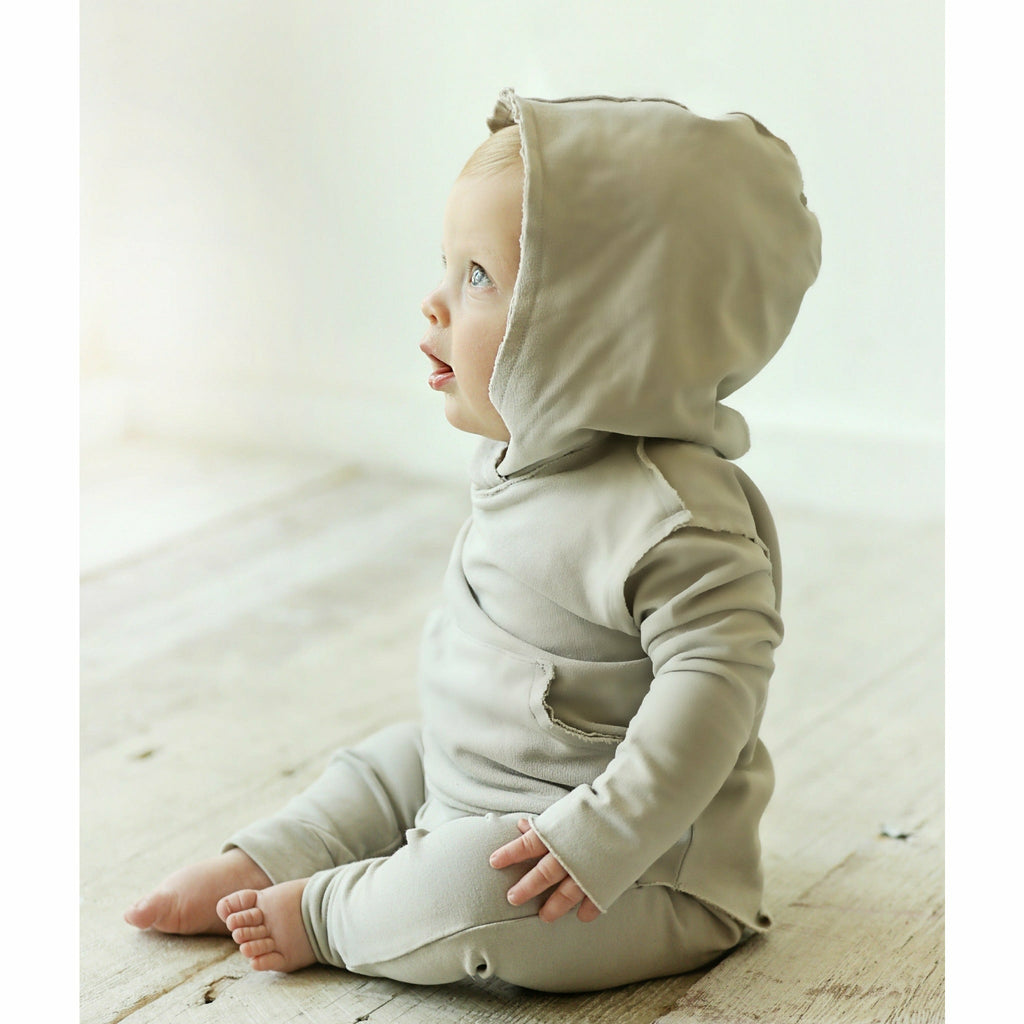 cute baby boy wearing organic hoodie  and pants beige grey