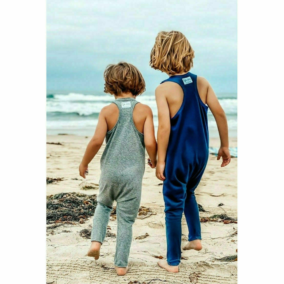 Navy romper by Be Mi Los Angeles featuring a stylish, casual design with short sleeves and a relaxed fit.