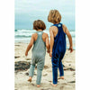 boys wearing socft cotton rompers on the beach navy and heather grey