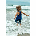 Navy romper from Be Mi Los Angeles featuring a stylish, casual design, displayed on a model with a relaxed fit.