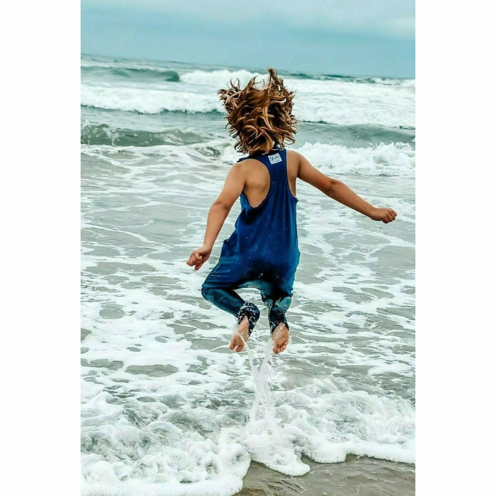 Navy romper from Be Mi Los Angeles featuring a stylish, casual design, displayed on a model with a relaxed fit.