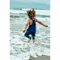 Navy romper from Be Mi Los Angeles featuring a stylish, casual design, displayed on a model with a relaxed fit.