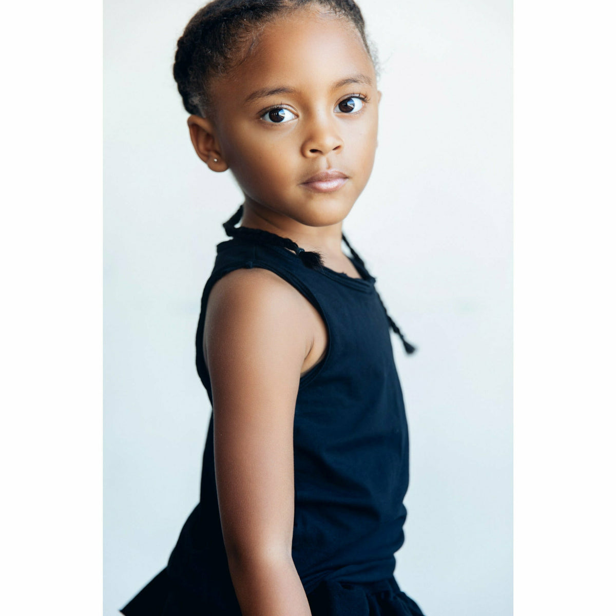 Black Asher Tank top by Be Mi Los Angeles, casual sleeveless shirt shown on a model.