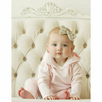 Pink organic baby hoodie by Be Mi Los Angeles featuring a cozy, soft design and a cute hood for comfortable infant wear.