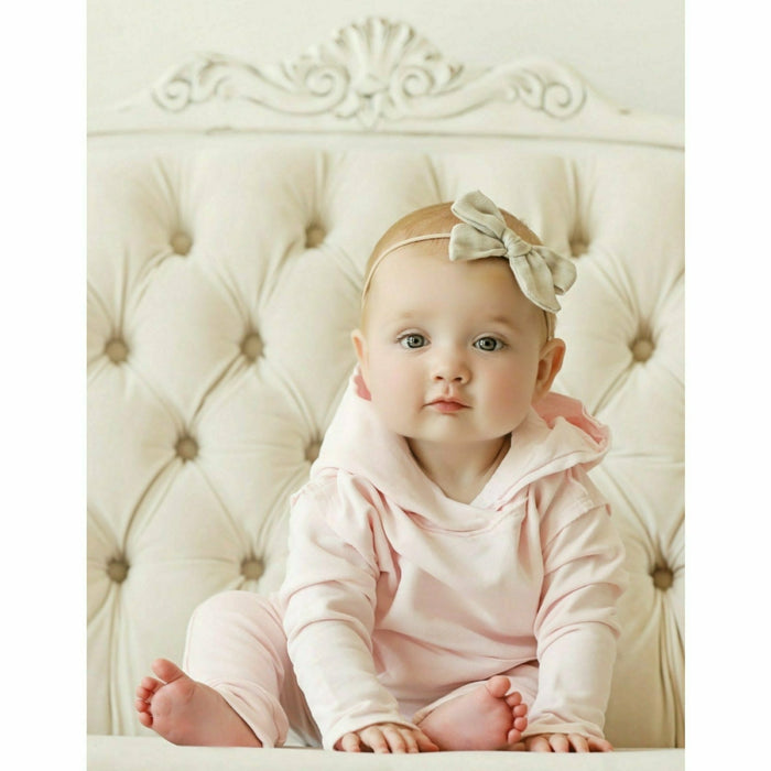 Pink organic baby hoodie by Be Mi Los Angeles featuring a cozy, soft design and a cute hood for comfortable infant wear.